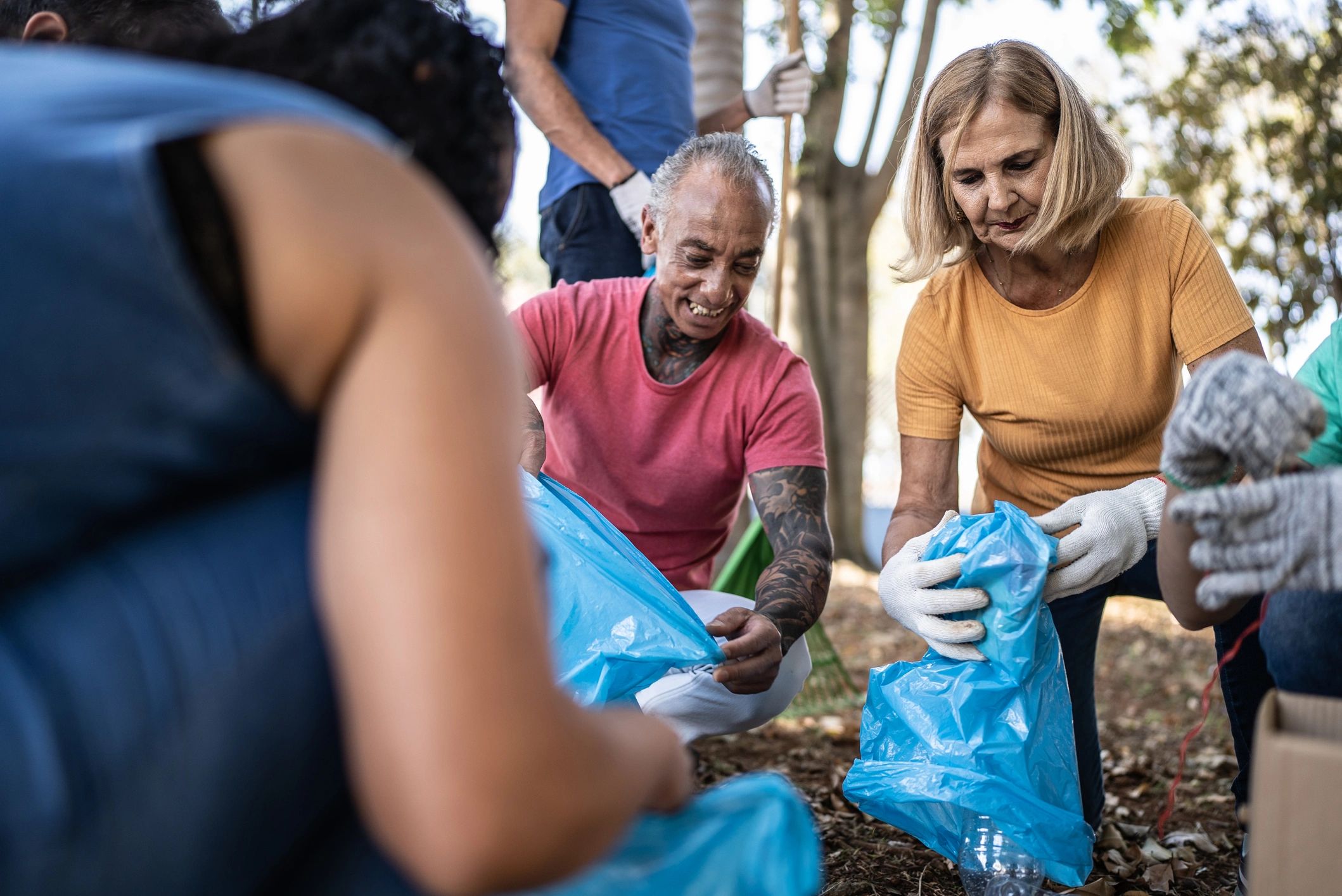 Community volunteers cleaning a public park together