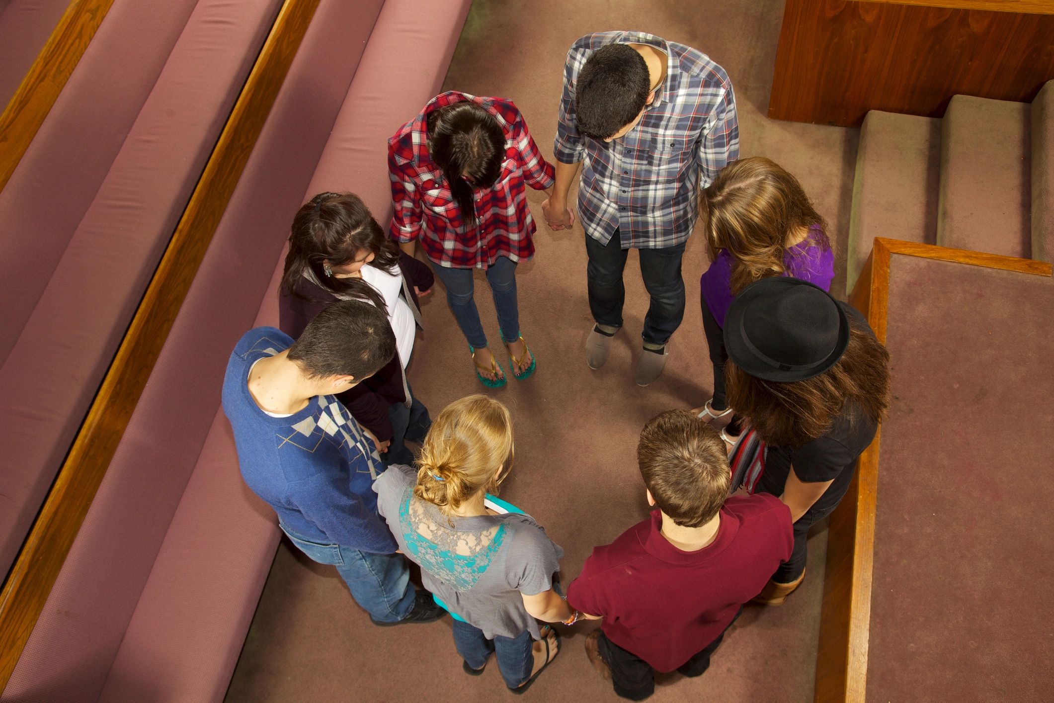 Teens praying together in worship