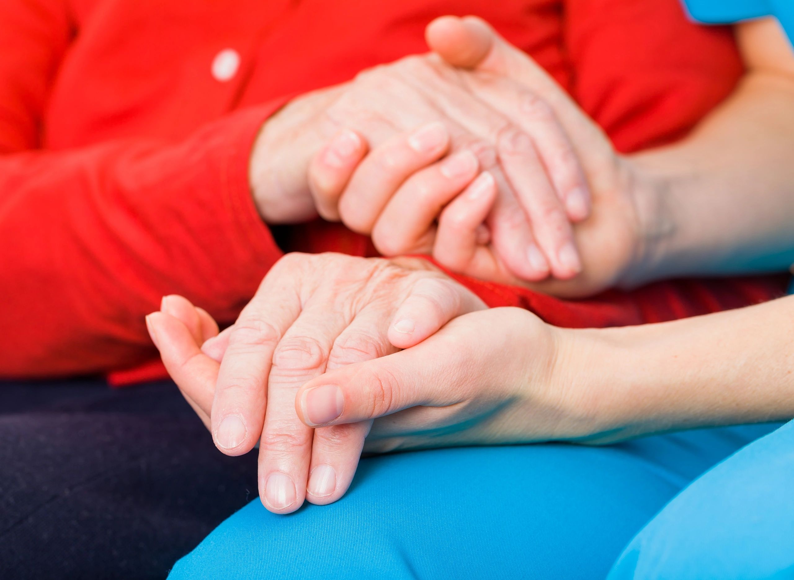 Hands offering support and care