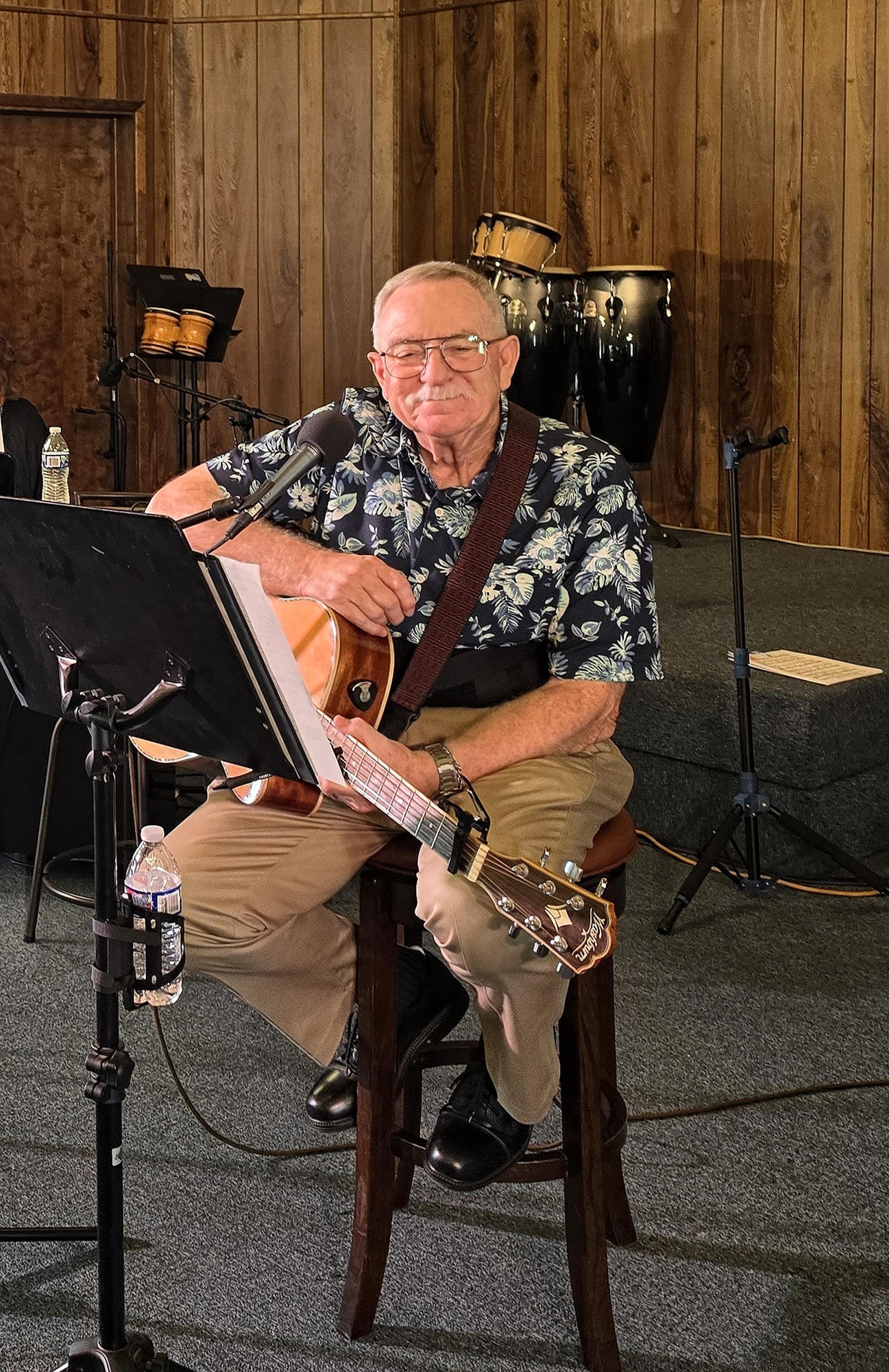 Visiting Pastor playing acoustic guitar during church worship